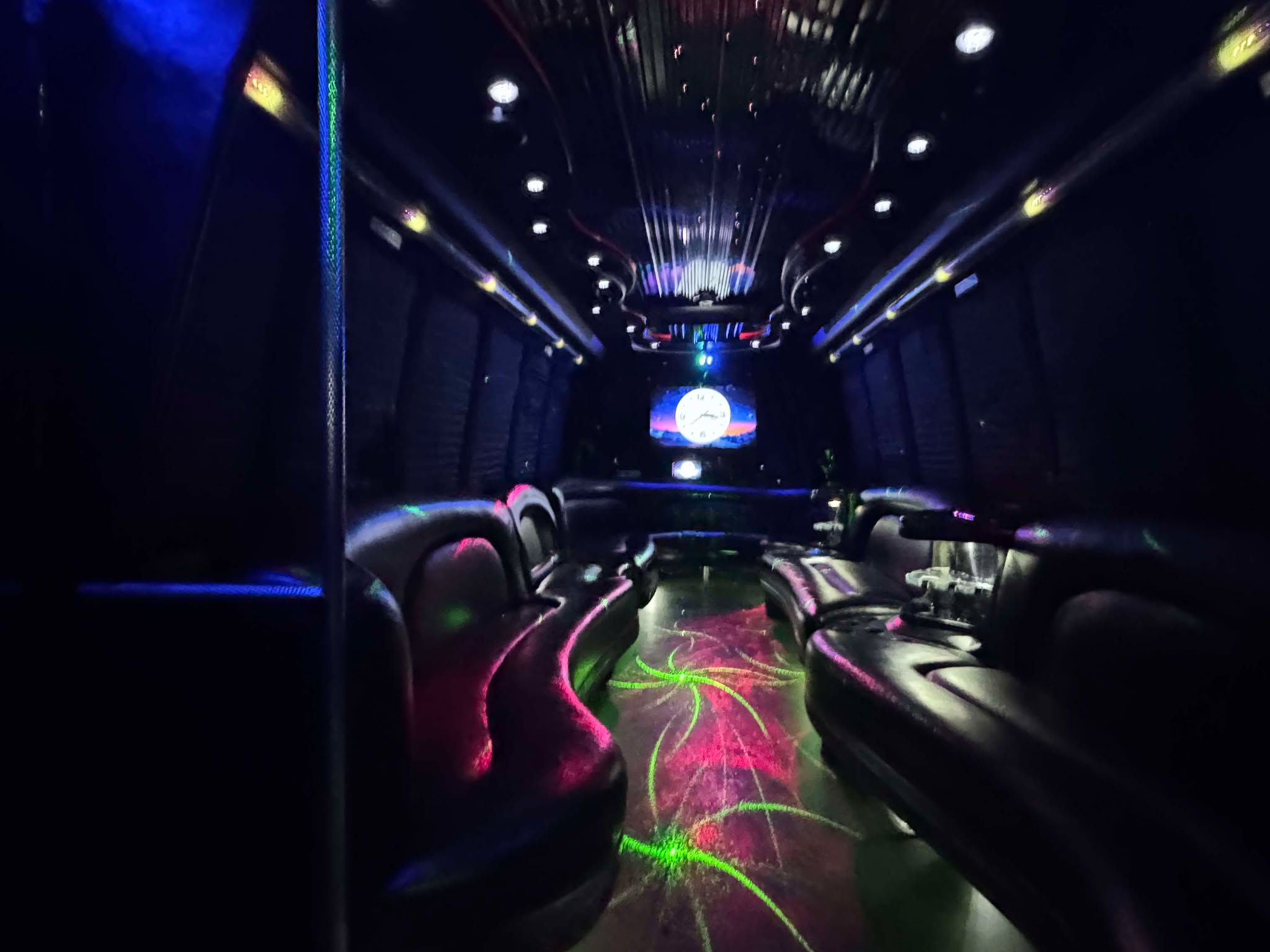 Luxury 28 Passenger Limo Party Buses in Atlanta featuring plush seating LED lighting and premium sound systems for upscale group celebrations.