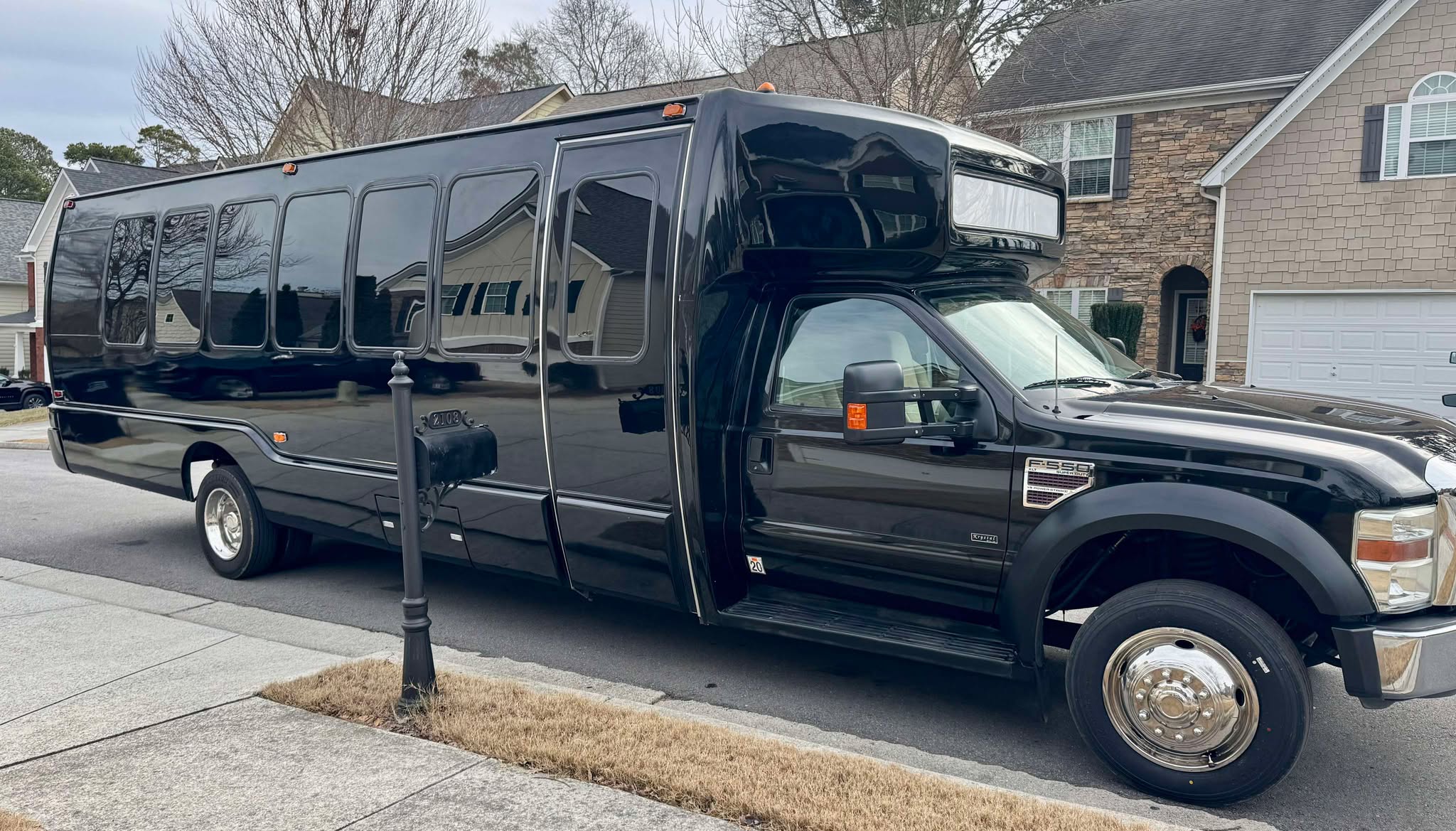 Spacious and stylish 28 passenger party buses for rent in Atlanta featuring luxury seating colorful LED lighting and top tier sound systems.